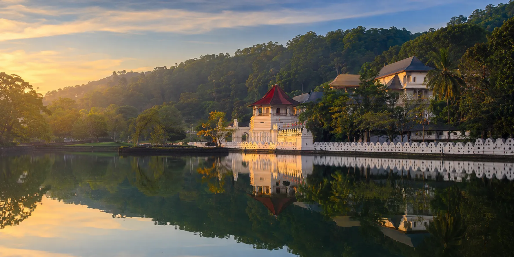 Kandy Lake and the Temple of the Sacred Tooth Relic in soft light.