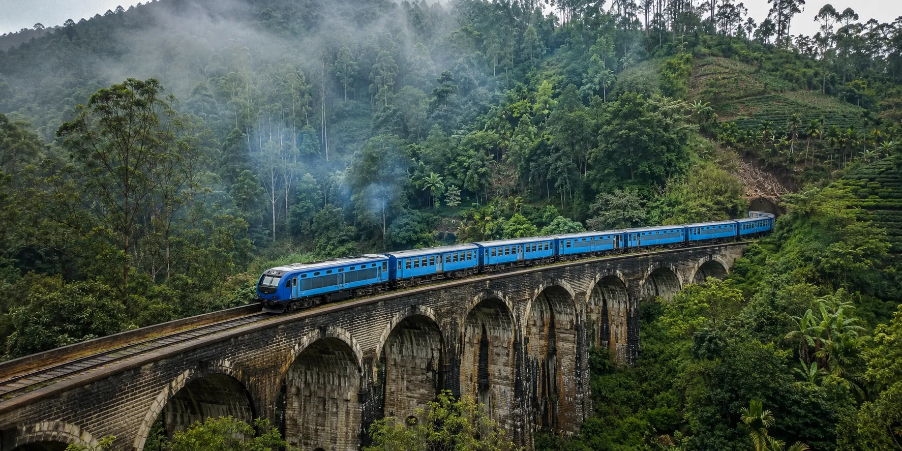 The hill-country train crossing the Nine Arch Bridge near Ella.